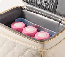 Compartiment du haut du sac isotherme biberon Securidou avec des boîtes de lait