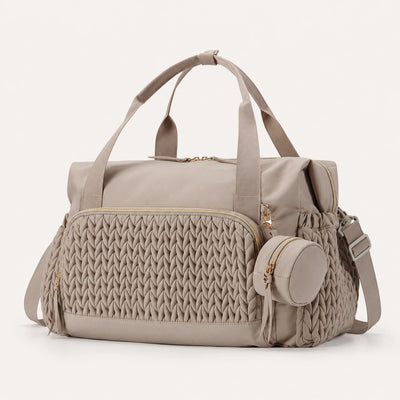 Sac à langer maternité Securidou coloris taupe, vue trois-quarts avec poignées renforcées et pochette tétine
