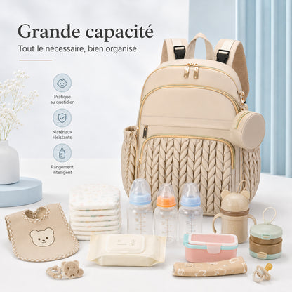 Sac à langer Securidou beige et tout le nécessaire de votre bébé : biberons, couches, lingettes et boîtes doseuses
